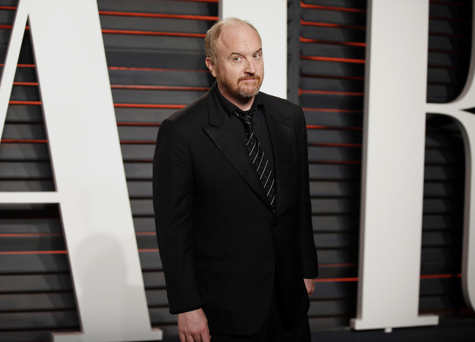 Comedian Louis C.K. arrives at the Vanity Fair Oscar Party in Beverly Hills, California