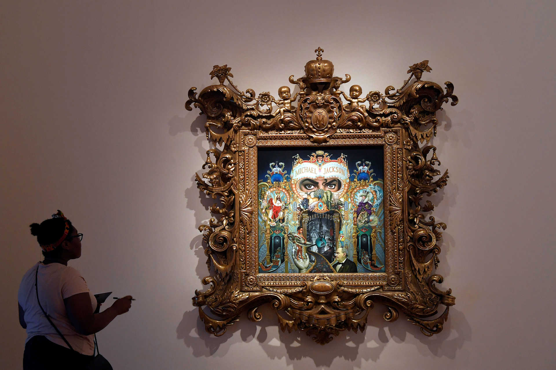 A visitor views ‘The King of Pop’ by Mark Ryden which forms part of the exhibition ‘Michael Jackson: On The Wall’ at the National Portrait Gallery in London, Britain