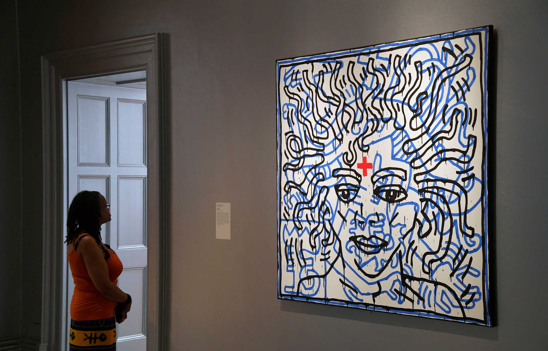 A visitor views Untitled by Keith Haring which forms part of the exhibition ‘Michael Jackson: On The Wall’ at the National Portrait Gallery in London, Britain