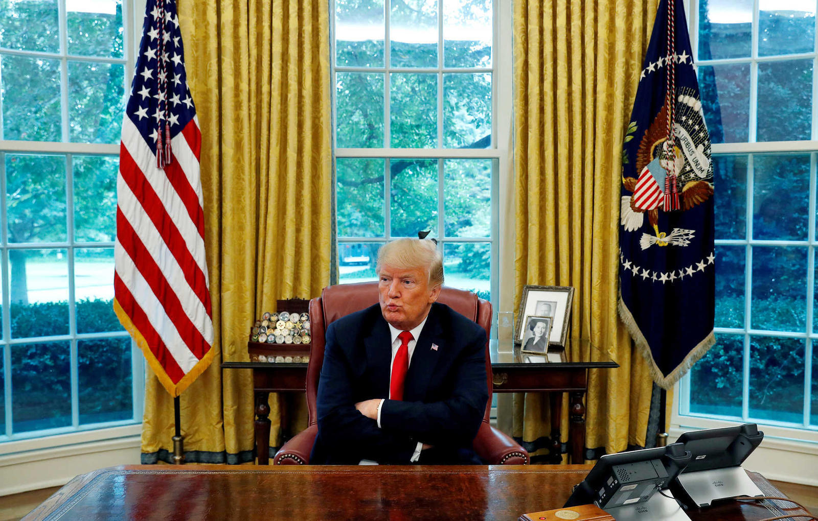 U.S. President Trump reacts to a question during interview with Reuters in the Oval Office of the White House in Washington